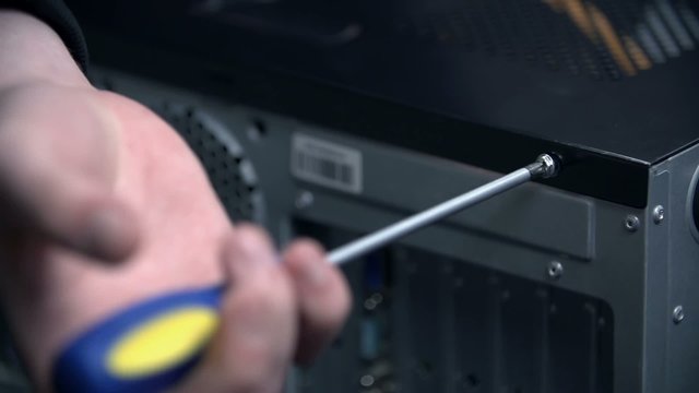 Removing the screw from side cover in slow motion