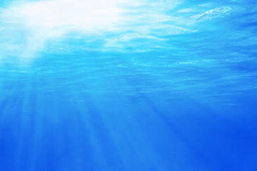 Fototapeta na wymiar Underwater sunlight through the sea surface