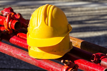 yellow hardhat on construction site