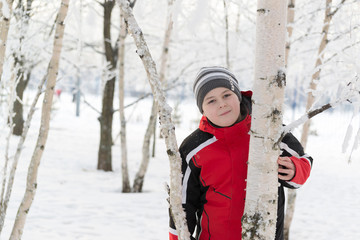 Teenager boy in winter park