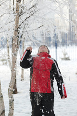 Teenager boy in winter park