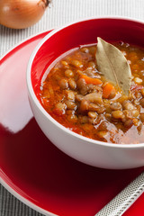 Traditional Mediterranean lentil stew in bowl.