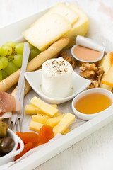 fresh cheese with honey, nuts and grape