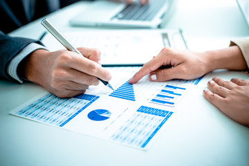 Business people discussing the charts and graphs showing the res