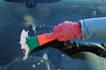 Automotive, ice cleaning from windshield scraper and hand - obrazy, fototapety, plakaty