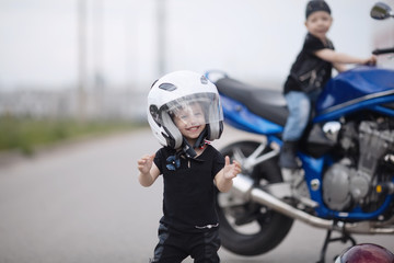 little bikers on road with motorcycle