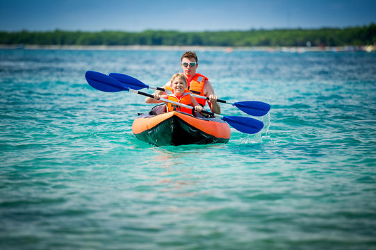 father and son in a kayak