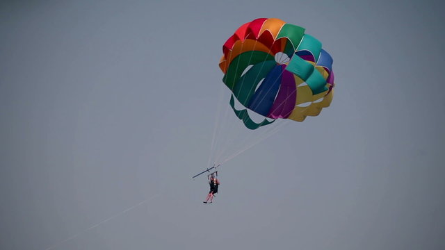 Close up of parachutist with colorful parachut flying