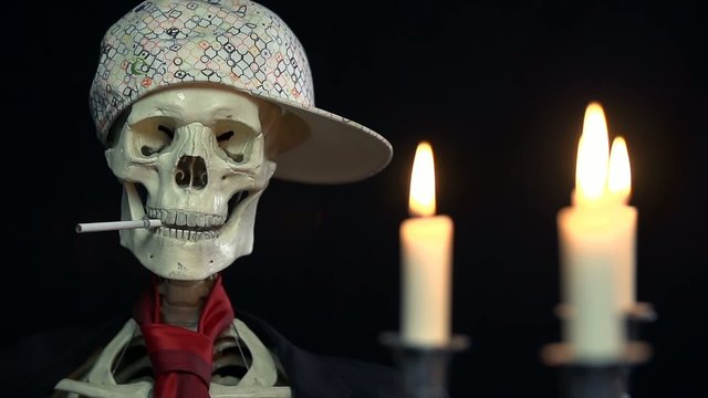 smoking skeleton with a baseball cap is sitting opposite of his girl