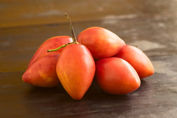 Pile of tamarillo fruits (lat. Solanum betaceum)
