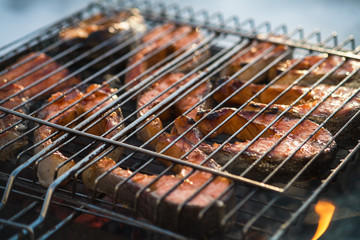 Norwegian trout on coals, on a lattice