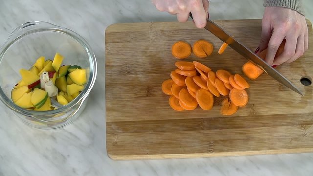 Slicing carrots into pieces