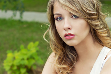 Naklejka premium beautiful sexy blonde girl in a Park with large plump lips