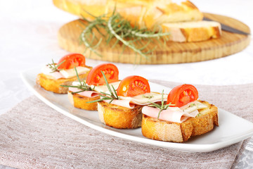 Bruschetta with tomato, ham and cheese