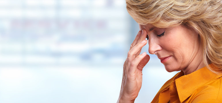 Woman having migraine headache.