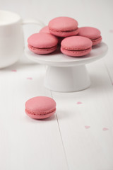 Macaroons Biscuits On White Stand. Paper Hearts