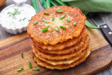 Potato pancakes on a wooden board