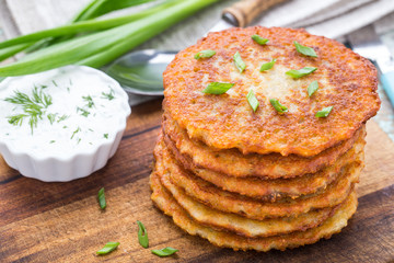 Potato pancakes on a wooden board