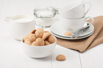Amaretti Biscuits. Kitchenware. White Wooden Table