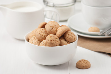 Amaretti Biscuits. Kitchenware. White Wooden Table