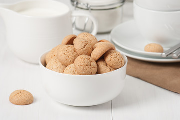 Amaretti Biscuits. Kitchenware. White Wooden Table
