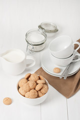 Amaretti Biscuits. Kitchenware. White Wooden Table