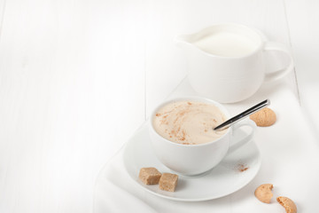 Amaretti Biscuits. Cup Of Cappuccino Coffee. Lump Demerara Sugar