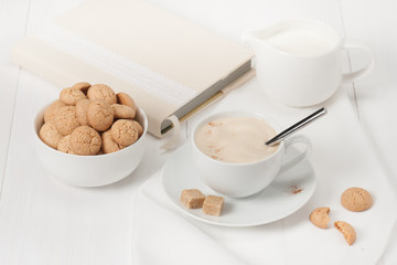 Amaretti Biscuits. Cup Of Cappuccino Coffee. Lump Demerara Sugar