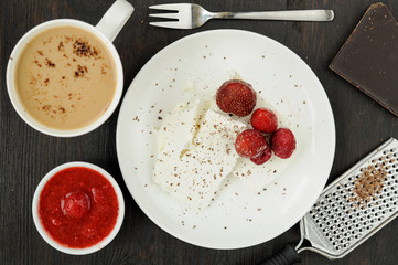 Cottage cheese with fresh berries and coffee with milk for break