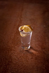 Tequila shot with lemon