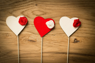 Love hearts on wooden texture background