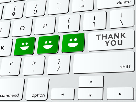 Thank you written over computer keyboard with happy faces