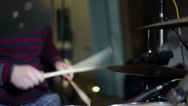 close up shot of musican playing drums