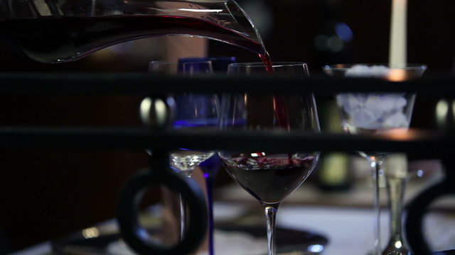 Cloce up of pouring wine in fancy restaurant