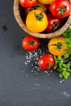 Farm fresh tomatoes with fresh basil herb and rock salt