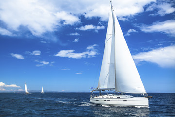 Sailing boat yacht or sail regatta race on blue water Sea. - obrazy, fototapety, plakaty