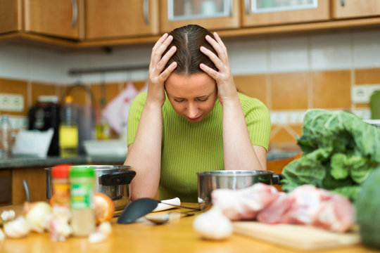 Unhappy female tired to cook
