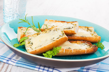 Garlic baguette with melted cheese.