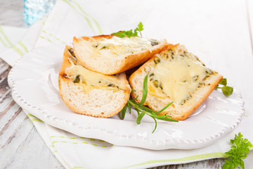 Garlic baguette with melted cheese.