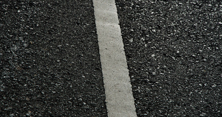 Asphalt dark texture with white lines