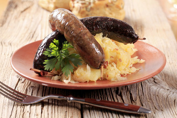 Roasted sausages with sauerkraut and potatoes