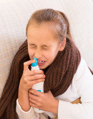 Sick child with nasal spray