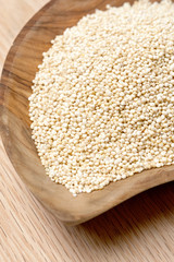 Quinoa seeds on a wooden bowl
