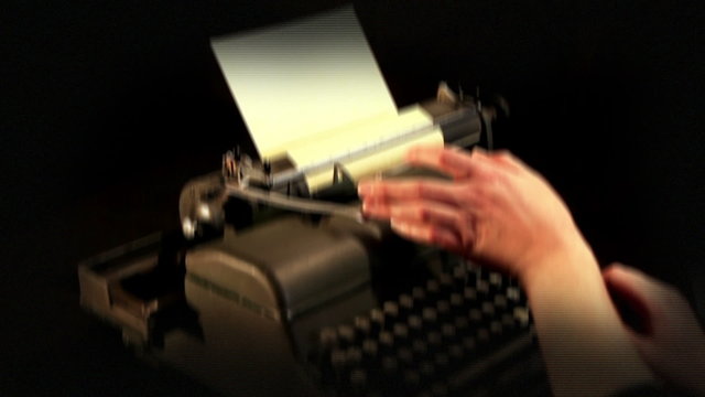 Dramatica camera movement and added video effect while showing typing on a typewriter