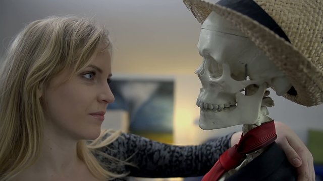 Woman seducing her plastic dancing partner with her flirting stare