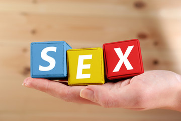 Sex spelled in color wooden blocks