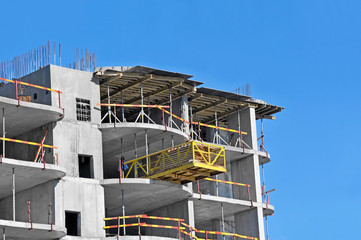 Building construction site work against blue sky