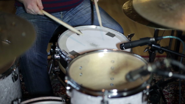 close up shot of musican playing drums