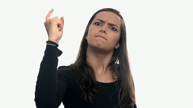 Woman very mad waving at camera on white background
