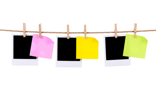Blank polaroid style photo print frame and sticky post it notes on a rope string or washing line